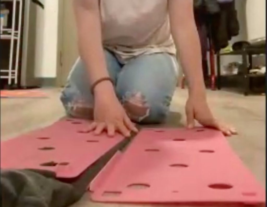 Step three, folding the right side of the device toward the middle.