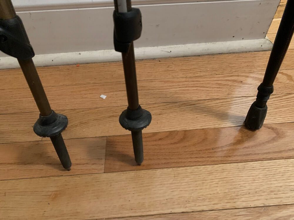 A close up of the spiky ends of some trekking poles